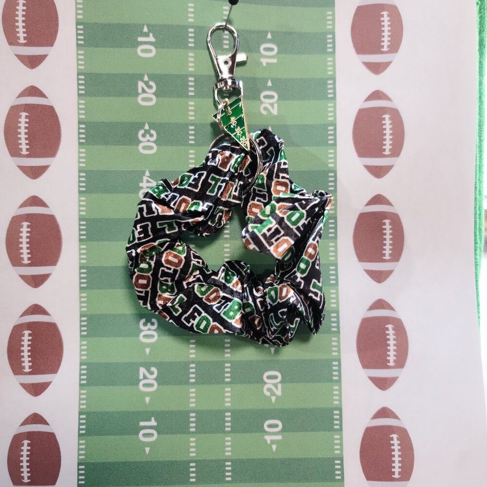 Football Themed Wristlet Keyring with a Football related charm attached !!